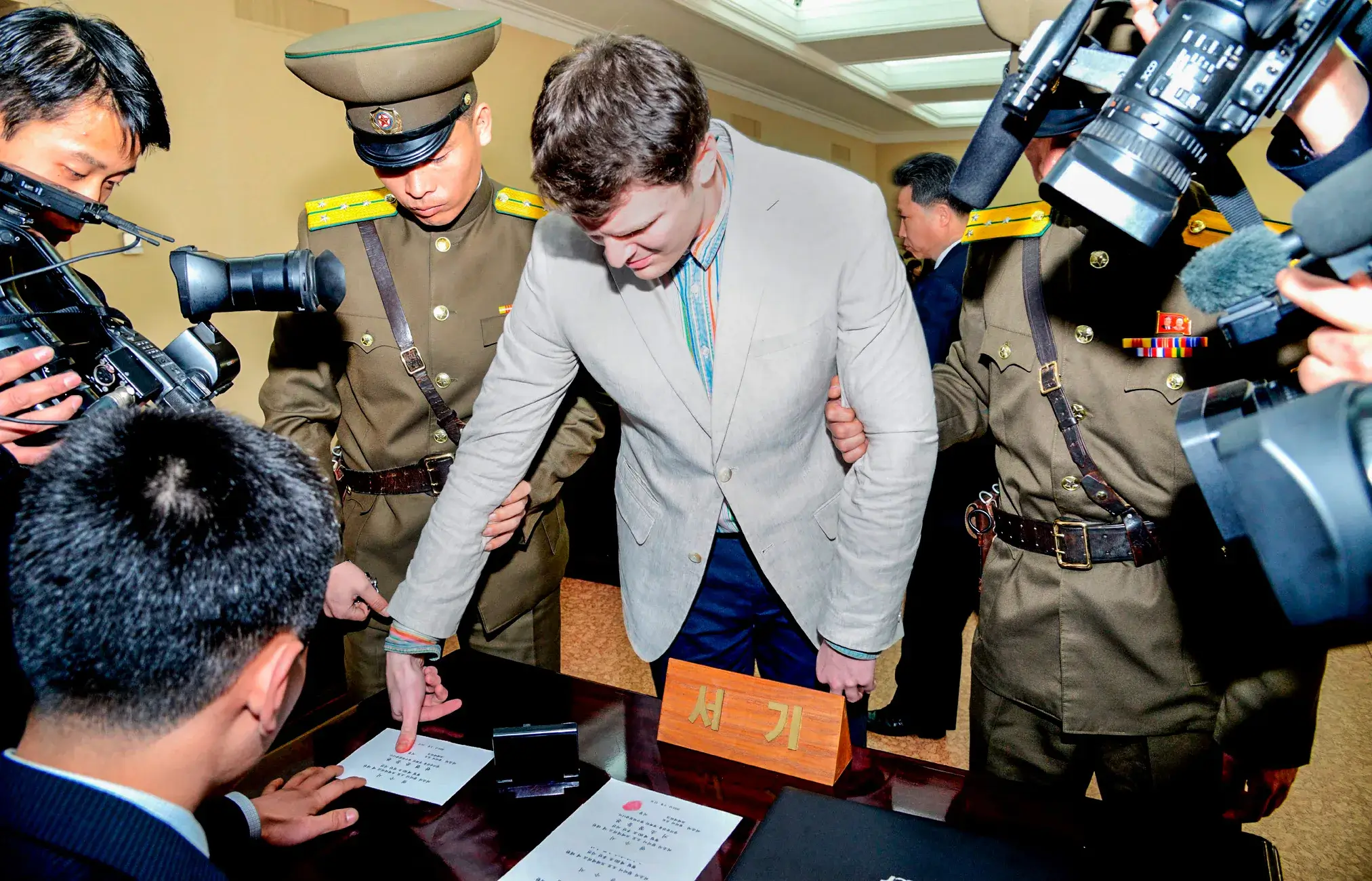 In this Feb. 29, 2016, file photo, American student Otto Warmbier speaks as he is presented to reporters in Pyongyang, North Korea. More than 15 months after he gave a staged confession in North Korea, he is with his Ohio family again. But whether he is even aware of that is uncertain. (AP Photo/Kim Kwang Hyon, File)